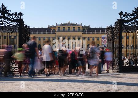 Crowd of people at Schonbrunn palace gate during day. Visitors, tourists. Vienna, Austria - September 28, 2023. Stock Photo