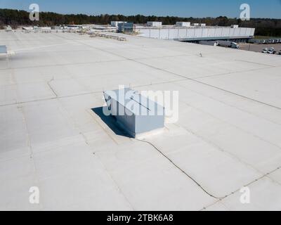 Drone images of the roof of a food distribution warehouse, and a neighborhood under construction Stock Photo