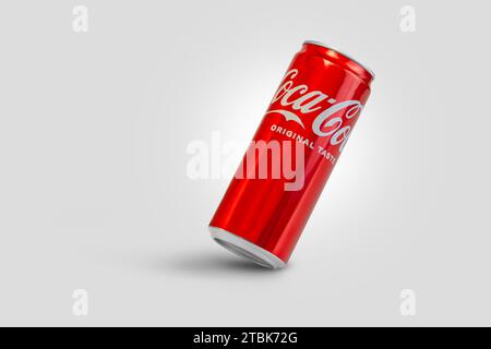 Chisinau, Moldova December 4 2023: Aluminum can of Cola view from an angle on a gray background. With clipping path Stock Photo