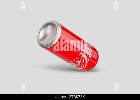 Chisinau, Moldova December 4 2023: Aluminum can of Cola view from an angle on a gray background. With clipping path Stock Photo