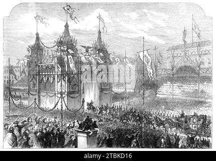 The Coronation of the King and Queen of Prussia: the King passing under the triumphal arch in the Alexander Platz [in Berlin] - from a sketch by our special artists, 1861.  View of '...the triumphal arch, a building the style of which is unparalleled in the history of architecture. This monster of human invention is as ugly as &#xa3;1500 can make it, with flags, banners, beams, velvet, statues, and escutcheons thrown promiscuously into a heap. Over the mass rise four excrescences, which, I suppose, are professionally called towers, though with an amount of euphemism that presses hard upon the Stock Photo