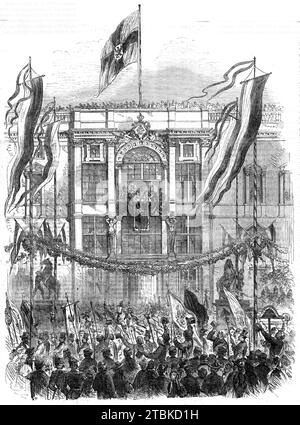 The Coronation of the King and Queen of Prussia: state entry into Berlin - the trades defiling before the royal party at the Schloss - from a sketch by our special artist, 1861. 'As usual, the butchers took precedence of everything, and were immensely cheered by the crowd. The chief of the illustrious body was mounted on a stupendous charger, and as he passed under the palace windows he...took off his hat and saluted in a style from which some of the crowned heads of Europe might take a lesson. The band of this renowned chieftain was the most numerous of the whole trades, being 126 in number, Stock Photo