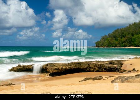 An isolated tropical quiet beach on the Pacific island of Kauai, Hawaii, USA. Stock Photo