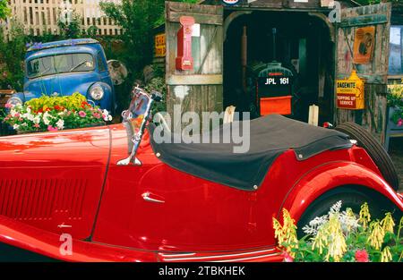 Traditional Garage with cars and flowers Stock Photo