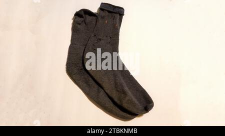 A Pair of Mens Socks with Holes Stock Photo