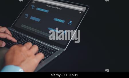 Businessman uses computer to type chat Ask and answer with the artificial intelligence system, chatbot, AI assistant. Stock Photo