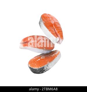 Fresh salmon steaks falling on white background Stock Photo - Alamy