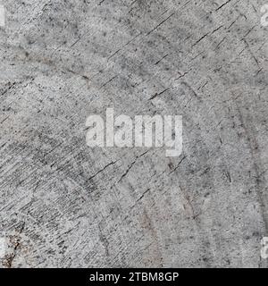 Background from a cross section of a tree trunk. Abstract texture from the rings of an old weathered stump with cracks Stock Photo