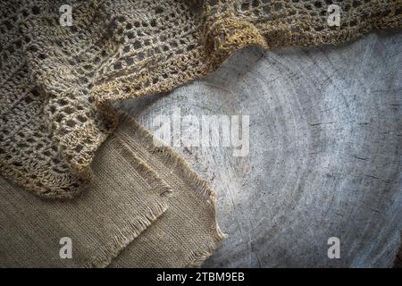 Background from cross section of tree trunk and natural linen napkins Stock Photo