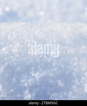 Background of fresh snow. Natural winter background. Snow texture in blue tone Stock Photo