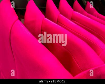 Women's Suit Jackets on Hangers in Retail Store Stock Photo