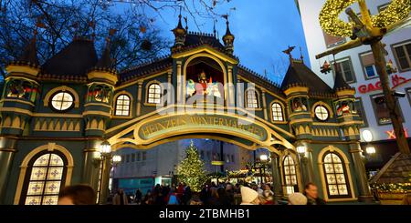 Cologne, Germany December 06 2023: entrance portal to the christmas market heinzels wintermaerchen in the old town of cologne at dusk Stock Photo