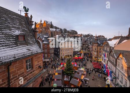 The lights at the Christmas market in Marburg's old town centre begin to glow in the evening, Wetterau, Marburg, Hesse, Germany Stock Photo