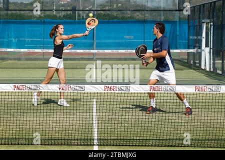 Young couple playing padel at the Club Robinson in Ugento, Apulia, Italy Stock Photo