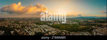 A sky sunset over a city with clouds and colours in the sky taken in a city from Mexico Stock Photo