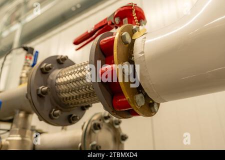 The interior of a mechanical room and a domestic potable water system with valves and connecting pipes. Stock Photo