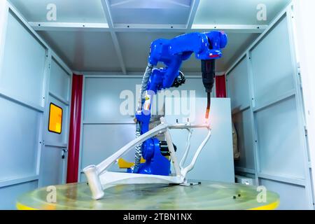 Automatic robotic arm for metal welding operations Stock Photo