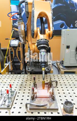 Welding robot in the process Stock Photo
