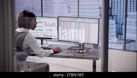 Business Analyst Working with Data on Stock Spreadsheet and Dashboard Stock Photo