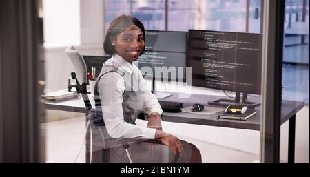 Web Developer Engineer Writing Code on Computer Screen Stock Photo