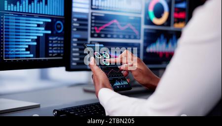 African Advisor Using KPI Dashboard With Financial Analytics Graphs Stock Photo