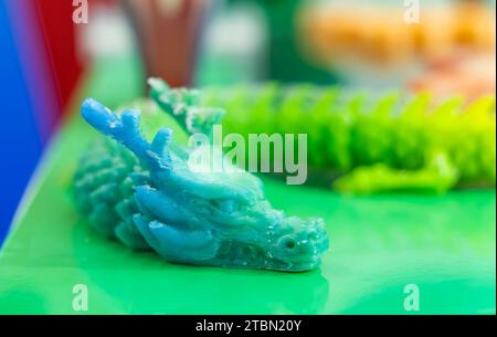 3D printer printing dragon head figure close-up. Stock Photo