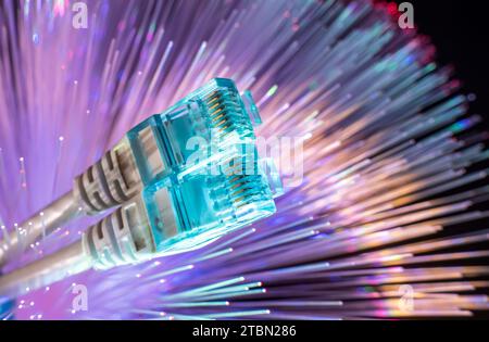 network cables closeup with fiber optical background Stock Photo