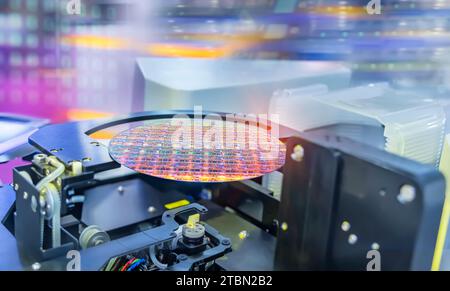 Semiconductor and Computer Chip Manufacturing at Fab or Foundry with robotic arms with silicon wafers Stock Photo