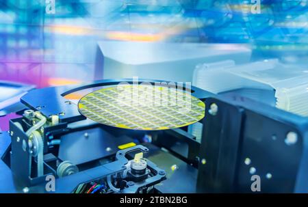 Semiconductor and Computer Chip Manufacturing at Fab or Foundry with robotic arms with silicon wafers Stock Photo