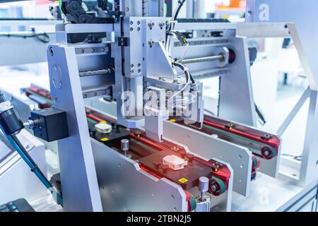 robot arm machine tool at industrial manufacture plant,Smart factory industry 4.0 concept. Stock Photo