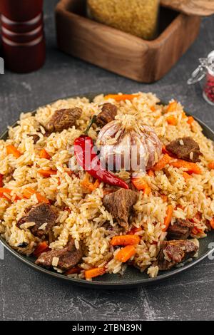 Large dish with Uzbek festive pilaf plov Stock Photo