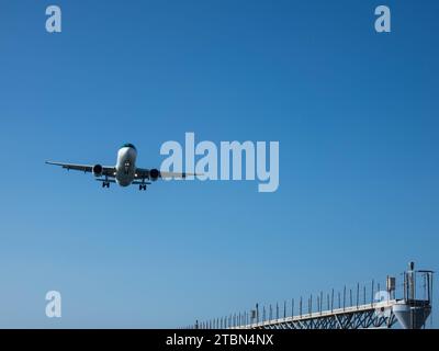 Airplane from the Ryan Air on approach for landing. Blue sky. Close up. November 08, 2023. Arrecife, Canary Island, Spain Stock Photo