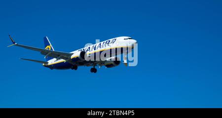 Airplane from the Ryan Air on approach for landing. Blue sky. Close up. November 08, 2023. Arrecife, Canary Island, Spain Stock Photo