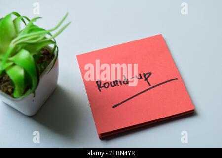 Concept of Round-up write on sticky notes isolated on white background. Stock Photo