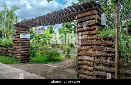 Wooden gate to the resort in Khanh Hoa province, Vietnam. East Asia travel Stock Photo