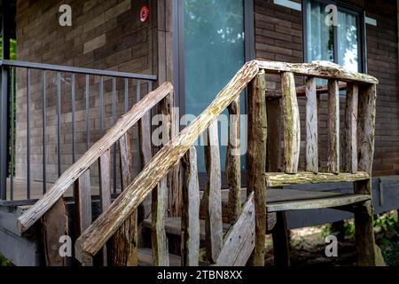 stilt house stairs made of dry wood Stock Photo