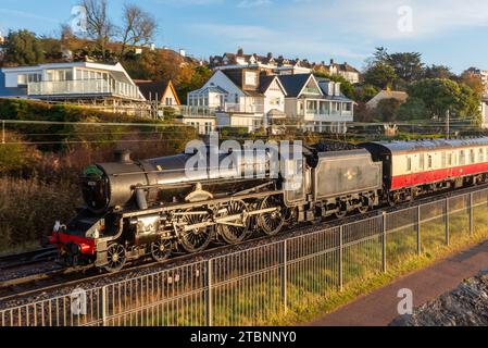 Chalkwell, Southend on Sea, Essex, UK. 8th Dec, 2023. A steam special train has set off from Southend on Sea to Winchester run by excursion operator Steam Dreams and hauled by LMS Stanier Class 5 4-6-0 ‘Black Five’ 45231, named The Sherwood Forester. 45231 was built in 1936 and served on British Railways until 1968. The route took the train on the C2C lines alongside the Thames Estuary here at Chalkwell Stock Photo