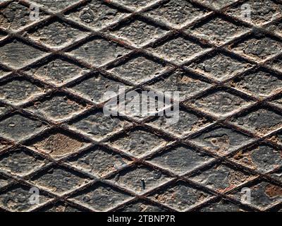 Rusty old weathered diamond plate texture close up top down view, background copy space Stock Photo
