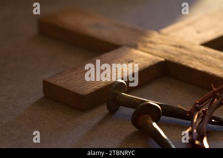 Crown of thorns, wooden cross and nails. Passion Of Jesus Christ concept Stock Photo