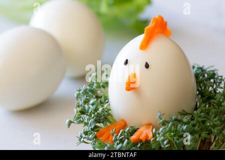 Easter chicken made of hard boiled egg with cress, funny appetizer easter Stock Photo