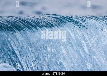 Waves breaking on the beach of Villajoyosa Stock Photo