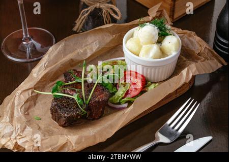 Baked beef with vegetables (carrots, peas, potatoes), horizontal Stock Photo