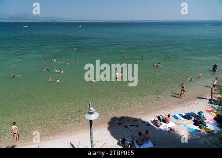 Spiaggia del Prete (Prete Beach) by Lago di Garda (Lake Garda) in Sirmione, Province of Brescia, Lombardy, Italy © Wojciech Strozyk / Alamy Stock Phot Stock Photo