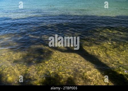 Spiaggia del Prete (Prete Beach) by Lago di Garda (Lake Garda) in Sirmione, Province of Brescia, Lombardy, Italy © Wojciech Strozyk / Alamy Stock Phot Stock Photo