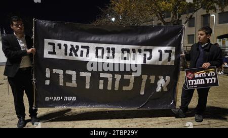 Right-wing activists hold a sign that reads 'There is no coexistence with the enemy' during a protest dubbed the 'March of the Maccabees' calling to restore full Jewish control in the Temple Mount on December 7, 2023 in Jerusalem. The protest was organized to memorialize victims of the Israel-Hamas war, while also demanding that the entirety of Jerusalem, including the Temple Mount/Al-Aqsa Mosque compound, be placed under Jewish control. Stock Photo