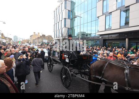 The funeral procession of Shane MacGowan makes its way through the streets of Dublin ahead of his funeral in Co Tipperary. The songwriter, who found fame as the lead singer of London-Irish punk/folk band The Pogues, died at the age of 65 last week. Picture date: Friday December 8, 2023. Stock Photo