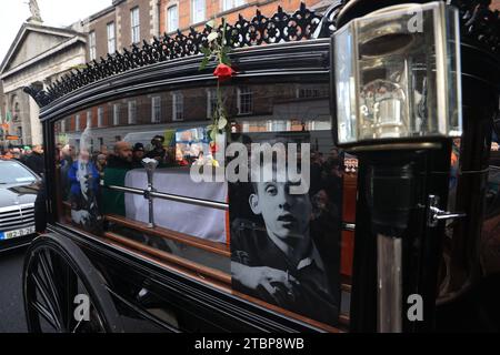 The funeral procession of Shane MacGowan on Westland Row makes its way through the streets of Dublin ahead of his funeral in Co Tipperary. The songwriter, who found fame as the lead singer of London-Irish punk/folk band The Pogues, died at the age of 65 last week. Picture date: Friday December 8, 2023. Stock Photo