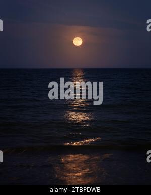 Moon rise over the shores of Malaga Stock Photo