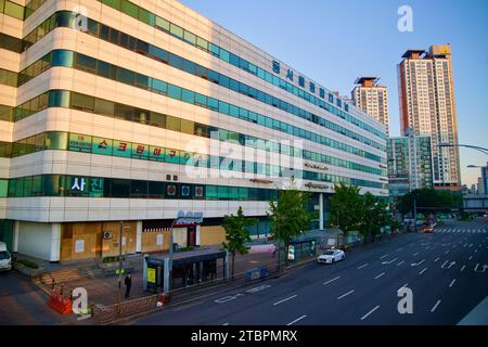 The bustling Dong Seoul Bus Terminal, captured here in its urban setting, stands as a vital transportation hub near Gangbyeon Station in Seoul. This i Stock Photo