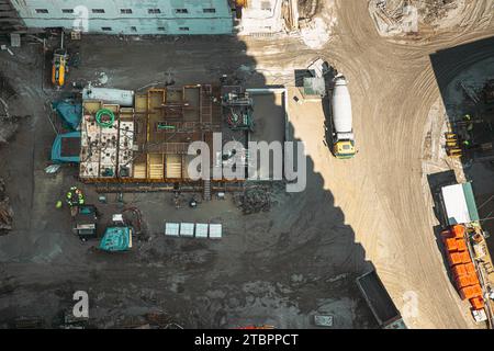 Various Machinery With Workers Are Engaged In Repairing Development On Construction Site. Hd Development Multistorey Residential Building. Preparation Stock Photo